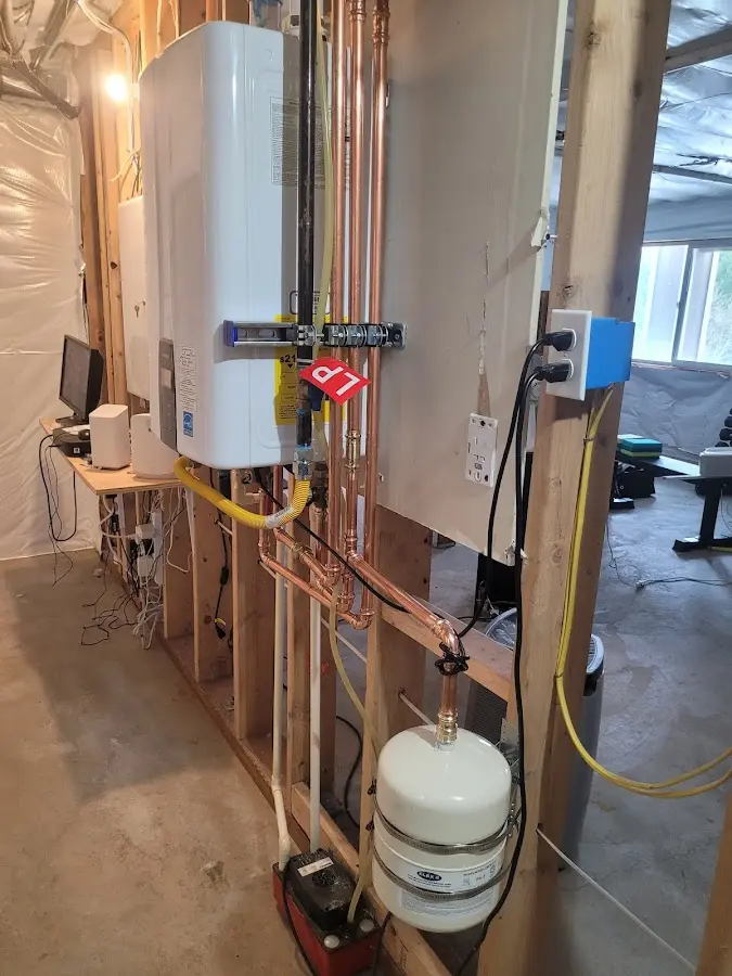 Licensed plumber repairing a kitchen sink in Carmel